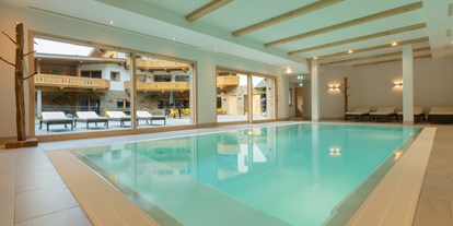 Hochzeit - nächstes Hotel - Tiroler Oberland - Wellnessbereich mit Innenpool, Fitnessraum und Saunabereich - das Chaletdorf - Pitztal