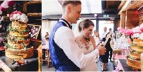 Hochzeit - Hochzeitsessen: mehrgängiges Hochzeitsmenü - Die Lisa Alm - Torte anschneiden
Foto © Alex Ginis  
https://hochzeitsfotograf-bayern.de/  - Lisa Alm